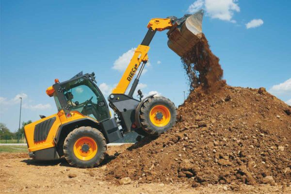 A yellow and black Dieci T90 Pivot Steer Telehandler is digging a pile of dirt.