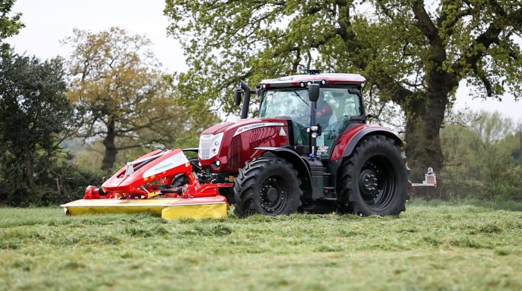 A red McCormick X7.624 V Shift tractor in the middle of a field.