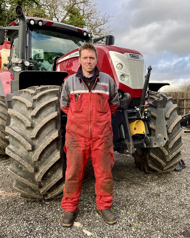 man in front of the tractor